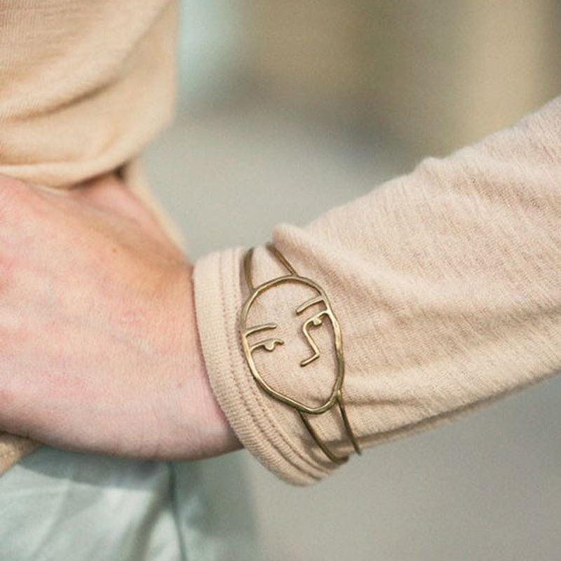 Abstract hollow smiley bracelet